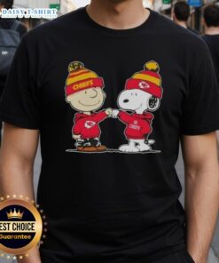 Good Peanuts Charlie Brown and Snoopy fist bump on Kansas City Chiefs football t-shirt design for fans.