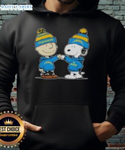 Charlie Brown and Snoopy fist bump in Los Angeles Chargers football hoodie, celebrating teamwork and friendship.