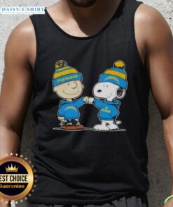 Charlie Brown and Snoopy fist bump in Los Angeles Chargers football tank top, celebrating friendship and sports spirit.