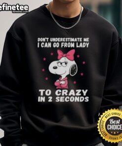 Good Peanuts Snoopy sweatshirt with 'Don't Underestimate Me' slogan, showcasing fun and quirky style.