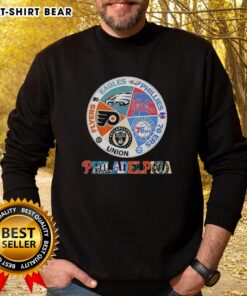 Cozy sweatshirt featuring logos of Philadelphia teams: Flyers, Eagles, Phillies, 76ers, and Union for fans.