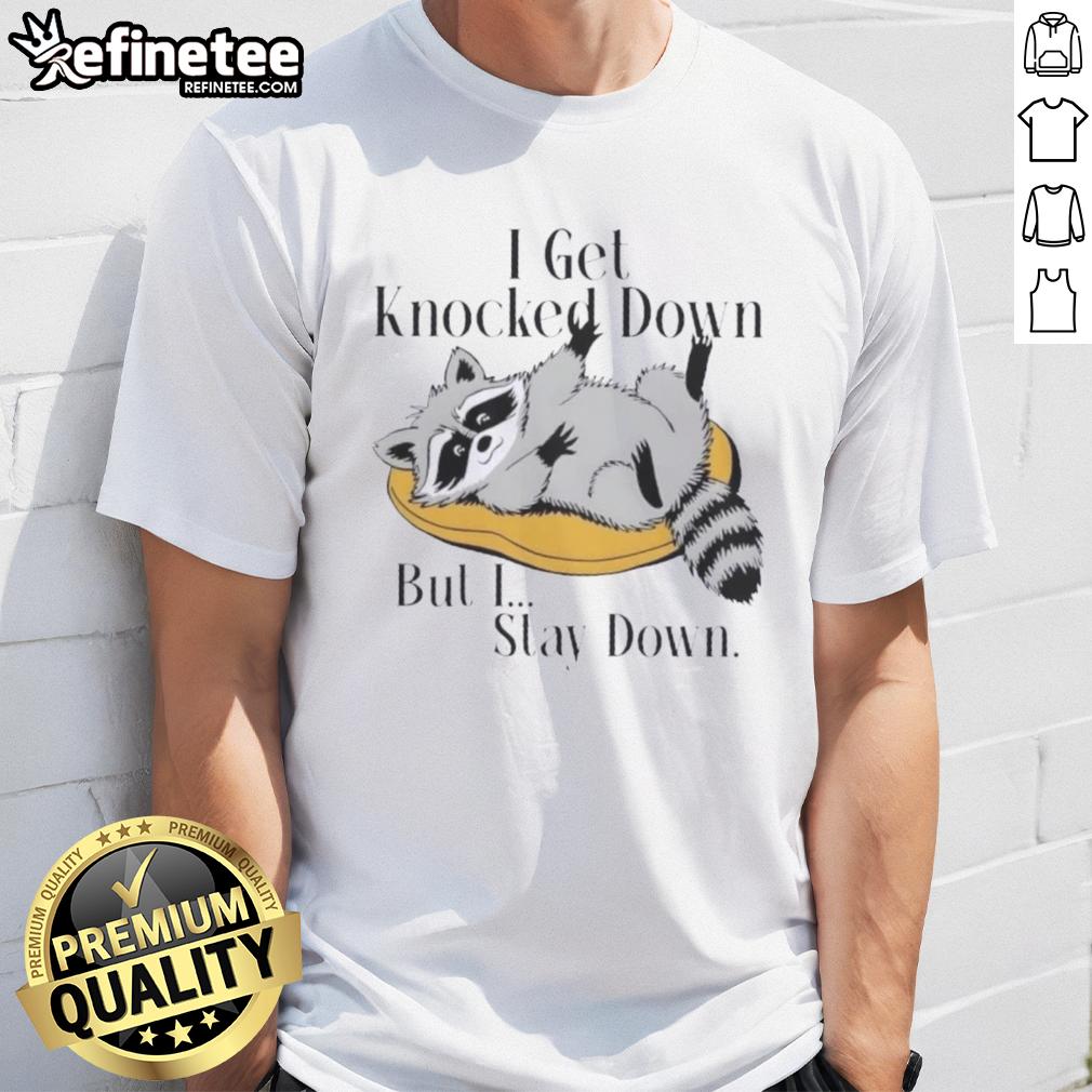 good-raccoon-meme-i-get-knocked-down-but-i-stay-down-t-shirt Good Raccoon meme t-shirt featuring 'I Get Knocked Down But I Stay Down' text with a cute raccoon illustration.