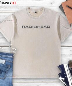 Alt Text: Vintage Good Radiohead Plug Me In I'm Your Best Friend washed t-shirt displayed on a wooden background.