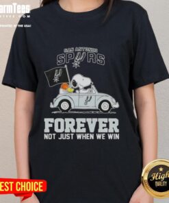 Alt Text: Snoopy driving a car in a San Antonio Spurs ladies tee, promoting team spirit with 'Forever, Not Just When We Win' slogan.