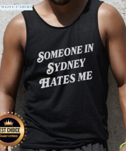 Stylish 'Good Someone in Sydney Hates Me' tank top displayed against a vibrant urban backdrop, perfect for casual wear.