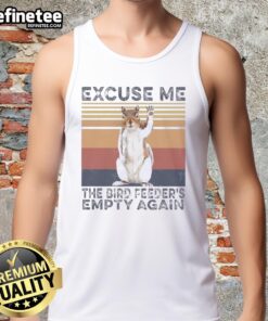 Good squirrel in a tank top looking surprised at empty bird feeders, showcasing humor and nature's playful moments.