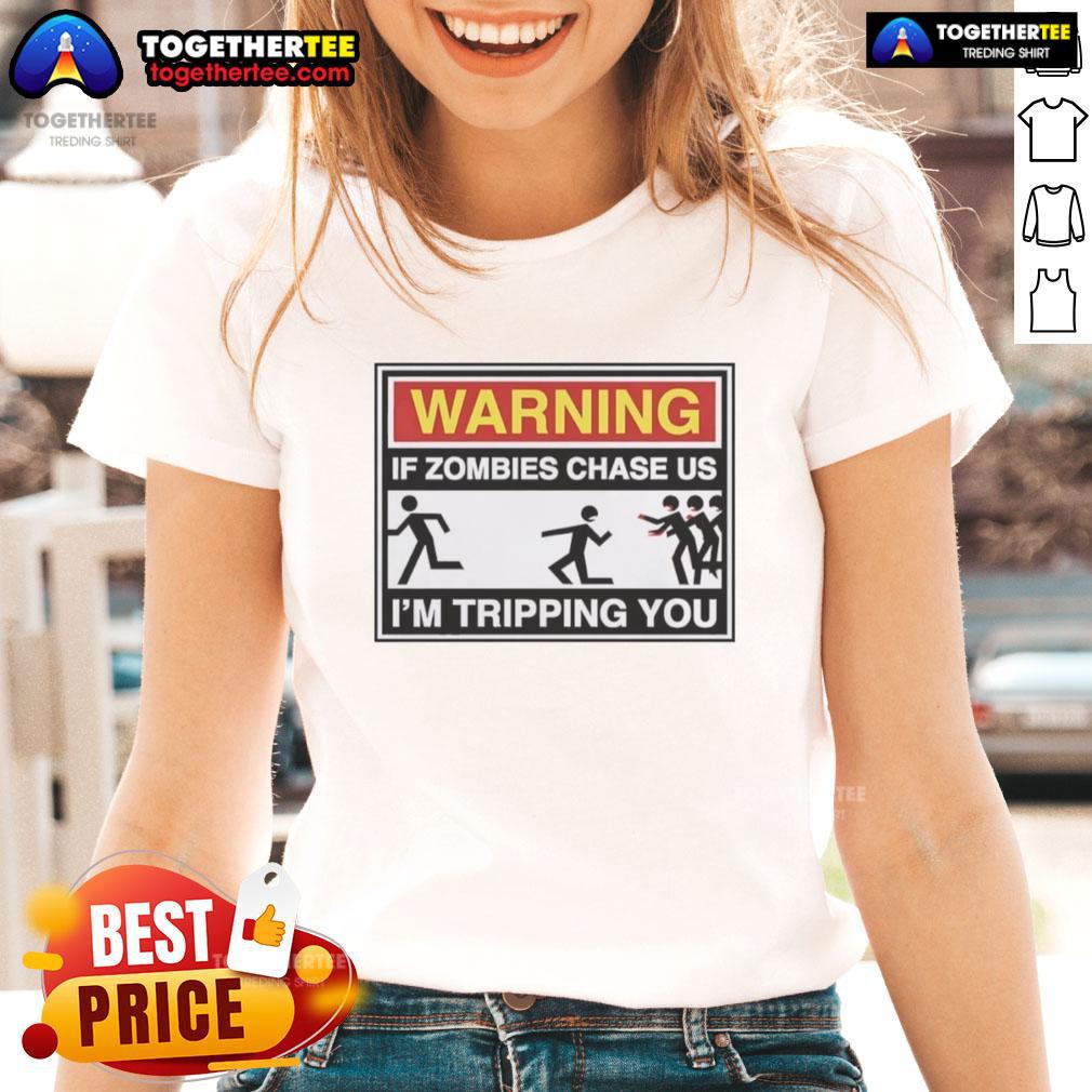 Good Warning If Zombies Chase Us I'M Tripping You Ladies Tee Good Warning: If zombies chase us, I'm tripping you ladies tee shirt featuring a humorous zombie survival quote.