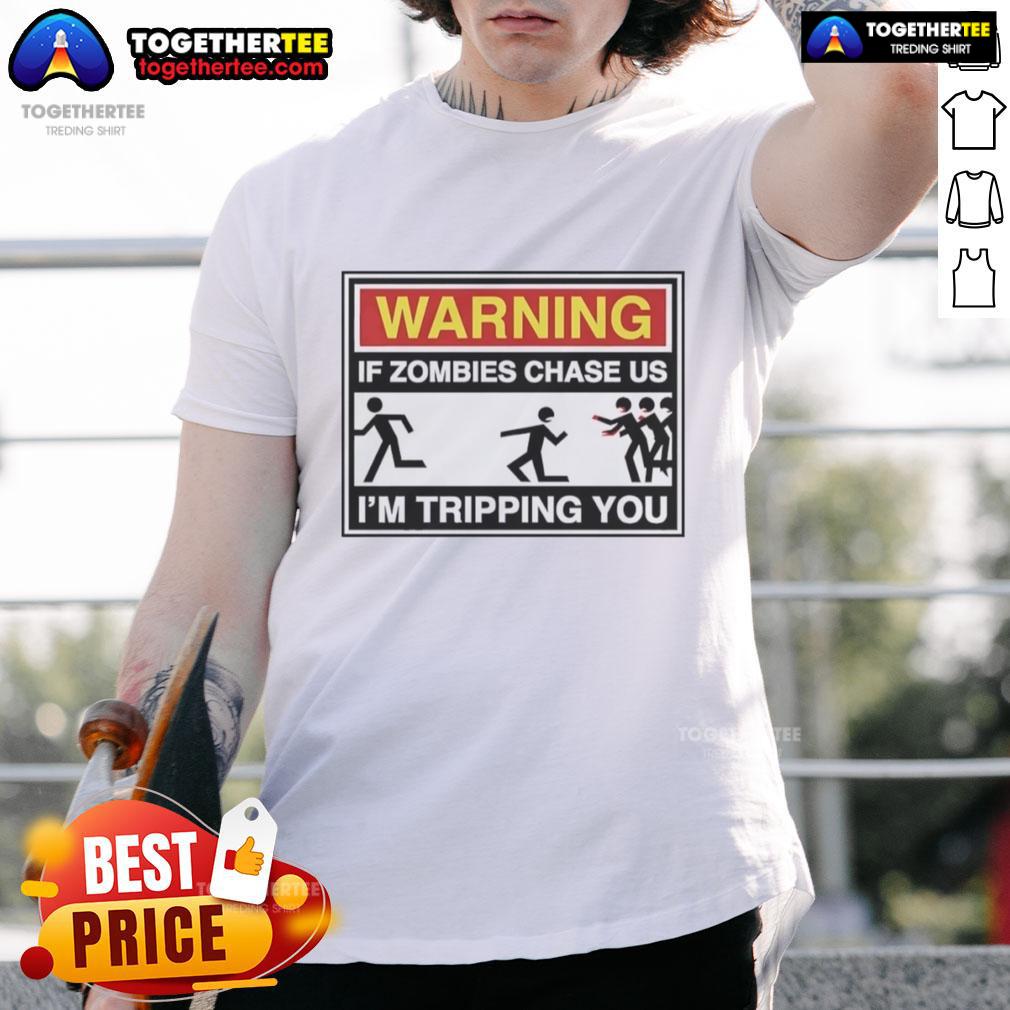 Good Warning If Zombies Chase Us I'M Tripping You T Shirt Good Warning If Zombies Chase Us Im Tripping You T-Shirt featuring a humorous zombie survival message in bold letters.