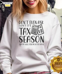 Person wearing a 'Happy Don't Even Ask, It's Tax Season' sweatshirt, highlighting tax season stress and humor.