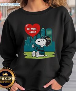 Happy Jacksonville Jaguars x Snoopy cartoon Valentine's sweatshirt for 2026, featuring fun graphics and team colors.