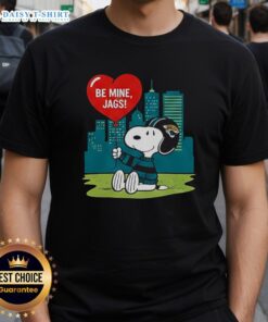 Alt Text: Happy Jacksonville Jaguars X Snoopy Cartoon Valentine 2026 T-Shirt featuring playful graphics and team colors.