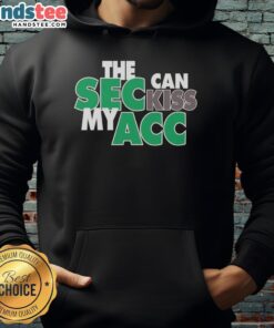 Happy Miami Hurricanes fan wearing 'SEC Can Kiss My ACC' hoodie, showcasing team spirit and pride at a game.