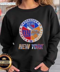 Happy New York City sports sweatshirt featuring Rangers, Knicks, and Giants logos for fans and team spirit.