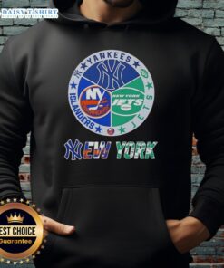 Alt Text: Happy New York City sports hoodie featuring Yankees, Jets, and Islanders logos for fans of NYC teams.