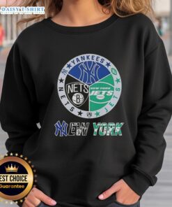 Happy New York City sports sweatshirt featuring Yankees, Jets, and Nets logos in a stylish design for fans.
