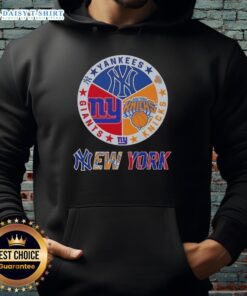 Alt Text: Happy New York City sports hoodie featuring Yankees, Knicks, and Giants logos for passionate fans.