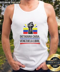 Protestor wearing a tank top with 'Venezuela Libre' slogan during a demonstration against dictatorship in Venezuela.