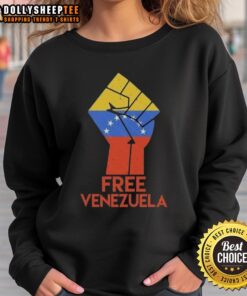 Alt Text: Hot Free For Venezuela Hand Fist Sweatshirt showcasing a bold graphic design promoting social justice and support.