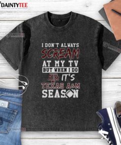 Alt Text: Texas A&M Aggies NCAA football lover washed t-shirt with humorous slogan about screaming at the TV during games.