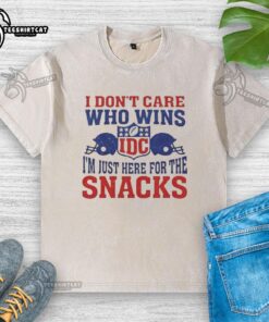 Hot I Don't Care Who Wins NFL T-Shirt featuring 'I'm Just Here for the Snacks' and Two Helmets design.