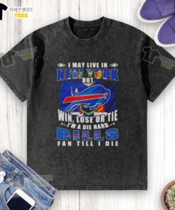 Alt Text: Die-hard Buffalo Bills fan wearing a washed T-shirt, showcasing pride with 'Hot I May Live In New York' slogan.