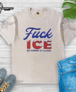 Alt Text: Stylish 'No Human Is Illegal' washed t-shirt with a hot snowy design, perfect for casual wear and social activism.
