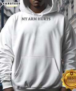Jimmy Herget wearing a 'My Arm Hurts' hoodie, showcasing casual style and humor in sports apparel.