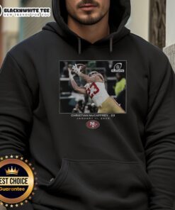 Christian McCaffrey in a San Francisco 49ers Wild Card hoodie, showcasing NFL Flash features for fans.