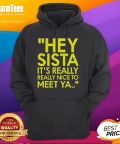 Cozy 'Hey Sista, It's Really Nice To Meet Ya' hoodie displayed on a wooden background, perfect for casual wear.