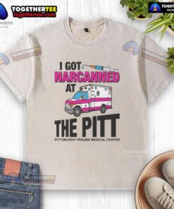 Nice I Got Narcanned at the Medical Center washed t-shirt displayed on a hanger, showcasing its vibrant design and message.