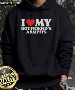 Girl wearing a red heart hoodie that says 'I Love My Boyfriend's Armpits' while smiling outdoors.