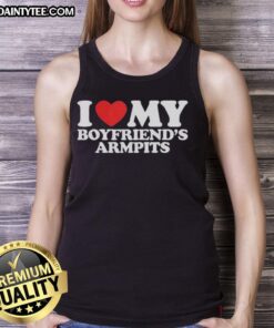 Woman wearing a 'Nice I Love My Boyfriend's Armpits' red heart tank top, showcasing a fun and playful fashion statement.