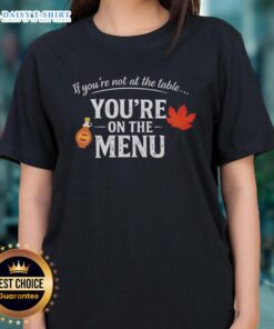 Nice If You're Not At The Table You're On The Menu Ladies Tee featuring bold text on a stylish shirt design.