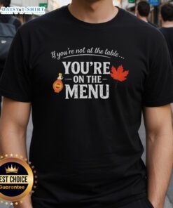Alt Text: Nice If You're Not At The Table You're On The Menu T-Shirt featuring a bold, eye-catching graphic design.