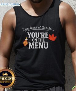 Stylish tank top featuring 'Nice If You're Not At The Table, You're On The Menu' slogan for bold statement fashion.