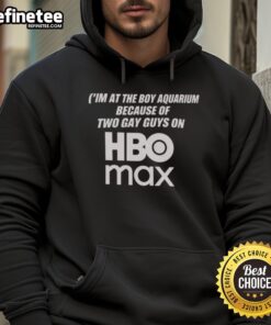 Two guys in HBO Max hoodies at an aquarium, enjoying the vibrant marine life and capturing the moment together.