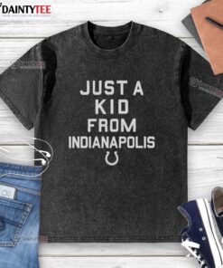 Alt Text: Nice Indianapolis Colts 'Just A Kid From Indianapolis' washed t-shirt displayed on a wooden background.