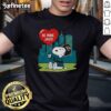 Alt Text: Jacksonville Jaguars X Snoopy cartoon Valentine 2026 T-shirt featuring fun graphics and vibrant colors for fans.