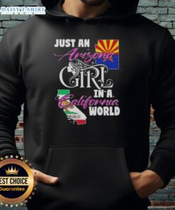 Woman wearing a 'Just An Arizona Girl In A California World' hoodie, showcasing casual style and sunny vibes.