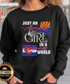 Arizona girl wearing a cozy sweatshirt in Colorado, showcasing the 'Just An Arizona Girl In A Colorado World' design.
