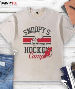 2026 Nice New Jersey Devils Snoopy's Hockey Camps washed t-shirt featuring vibrant team colors and playful design.