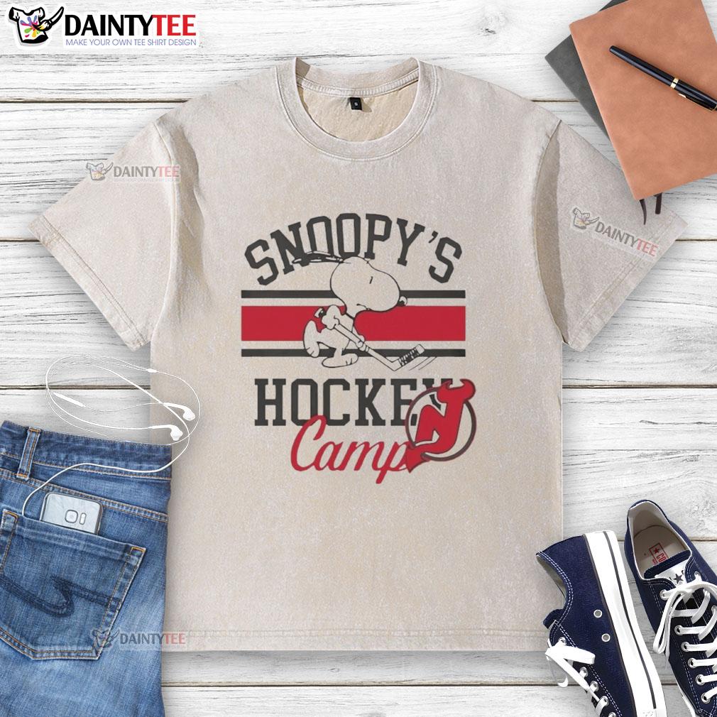nice-new-jersey-devils-snoopys-hockey-camps-2026-washed-t-shirt 2026 Nice New Jersey Devils Snoopy's Hockey Camps washed t-shirt featuring vibrant team colors and playful design.