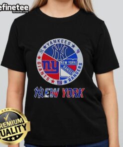 Alt Text: Ladies tee featuring combined logos of New York Yankees, Rangers, and Giants for NYC sports fans.
