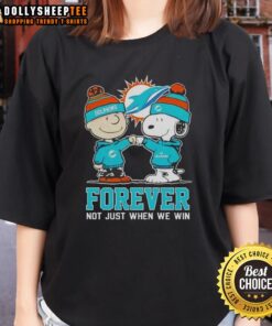 Ladies tee featuring Snoopy and Charlie Brown with Miami Dolphins theme, celebrating fandom beyond just winning.