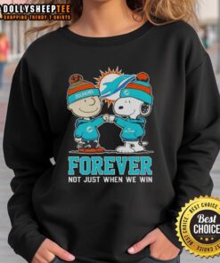 Nice Peanut Snoopy and Charlie Brown Miami Dolphins sweatshirt, celebrating fandom with 'Forever, Not Just When We Win' slogan.