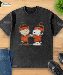 Charlie Brown and Snoopy fist bump on a Cincinnati Bengals football washed t-shirt featuring Nice Peanuts design.