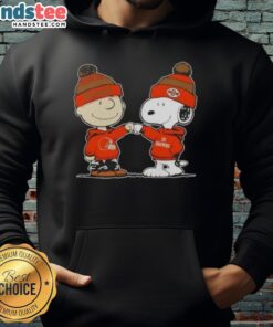 Alt Text: Charlie Brown and Snoopy giving a fist bump in a Cleveland Browns football hoodie, showcasing Nice Peanuts style.