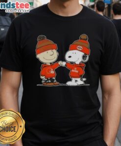 Charlie Brown and Snoopy fist bump on a Cleveland Browns football T-shirt featuring Nice Peanuts design.