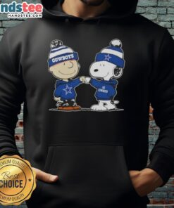 Charlie Brown and Snoopy fist bump in a Dallas Cowboys football hoodie, celebrating friendship and team spirit.