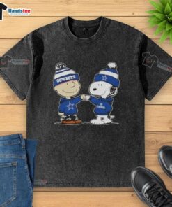 Charlie Brown and Snoopy fist bump on a Dallas Cowboys football washed t-shirt, perfect for fans of Nice Peanuts.